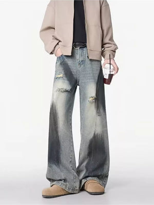 Distressed wide-leg jeans with belt detail and gradient wash