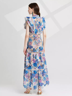 Maxi dress with floral lace, cutout details, and ruffled sleeves in blue and pink purple.