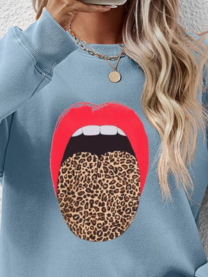 Light Blue sweatshirt with bold red lips and leopard tongue graphic.