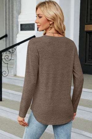 Mocha long sleeve sweater with side button slit hem, crew neck, and curved hem.
