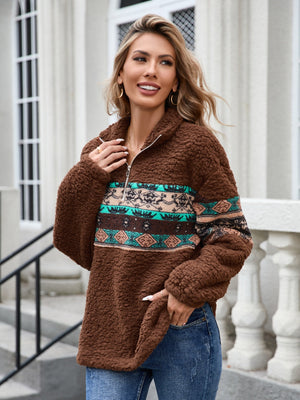 Brown sherpa quarter-zip pullover with Aztec trim and a relaxed fit.