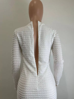 White textured midi dress with decorative buttons and crew neck.