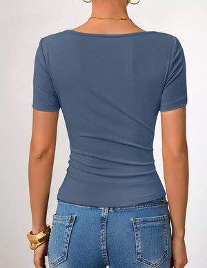 Blue asymmetrical fitted maternity t-shirt with short sleeves and a scoop neck.