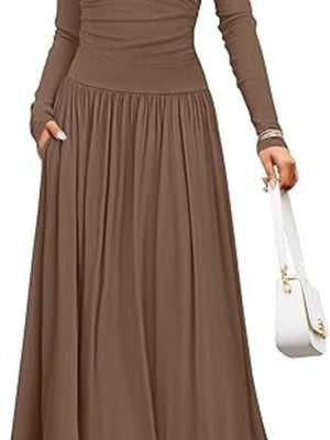 Elegant ruched maxi dress in coffee with long sleeves and pockets, styled with a white handbag.