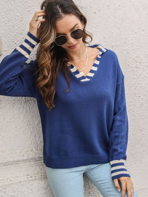 Royal blue acrylic v-neck sweater with striped trim on neckline and cuffs