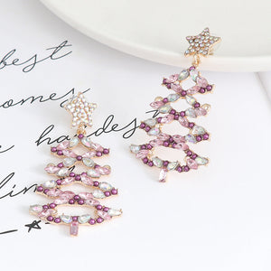 Festive crystal tree dangle earrings with star top in lilac and light green hues.