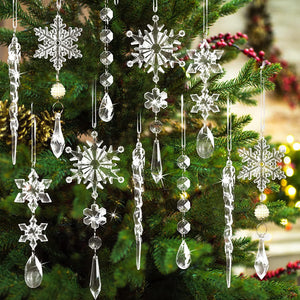 Transparent acrylic snowflake and icicle Christmas ornaments cascade on a tree.