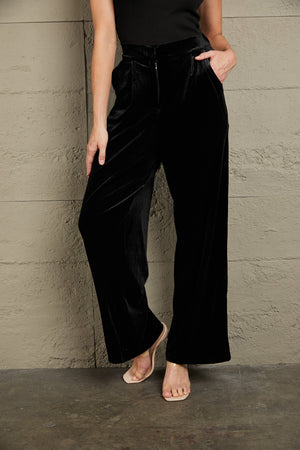 Black velvet palazzo trousers with high waist and wide leg