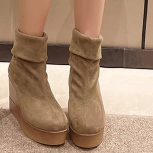 Apricot suede wedge boots with cuffed tops and platform soles