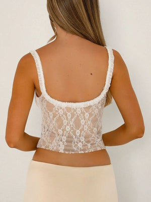 Lace ruffle trim cami with bow detail, white lace over tan lining.