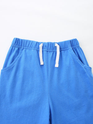 Blue cotton toddler shorts with elastic waistband and white drawstring.