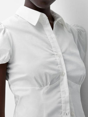 White puff sleeve fitted button-up shirt with ruched bodice detail.
