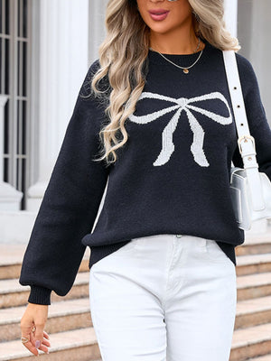 Black acrylic sweater with white bow graphic, long sleeves, and crew neck.
