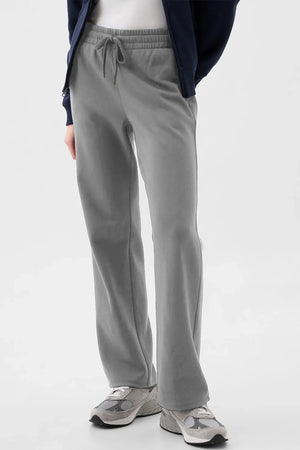 Relaxed-fit lounge trousers in dark gray with drawstring waist and pockets.