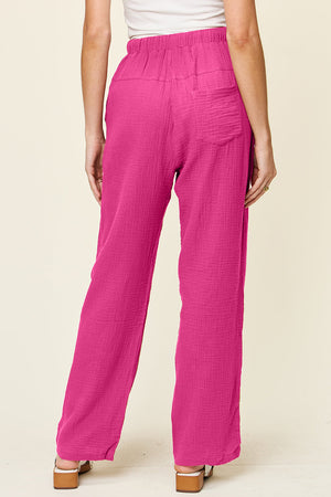 Textured gauze relaxed drawstring trousers in hot pink with a back pocket detail.