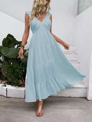 Light blue tiered maxi dress with flutter sleeves and V-neck.