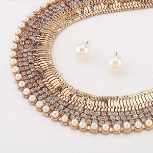 Gold-plated pearl and rhinestone choker necklace with matching stud earrings.