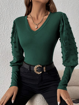 Dark green ribbed v-neck bodysuit with sheer pom-pom detail sleeves