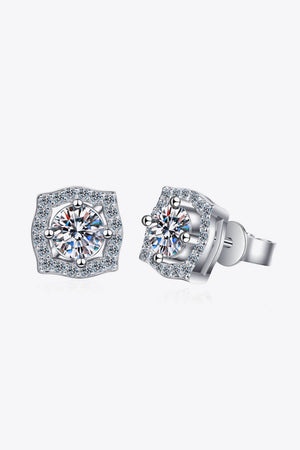 Scalloped halo moissanite stud earrings in silver with a central round-cut stone surrounded by smaller stones.
