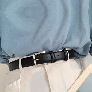 Classic black cowhide leather belt with silver buckle, adjustable for adults.