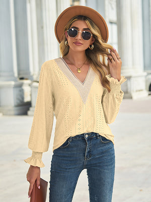 Canary yellow eyelet lace inset blouse with blouson sleeves and ruffled cuffs.