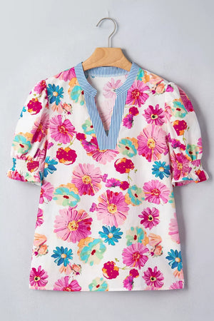 Vibrant floral print cotton blouse with V-neck and striped trim, short puff sleeves with smocked cuffs.