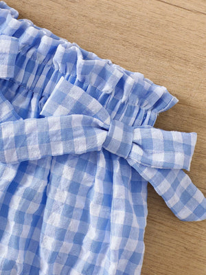 Blue gingham cotton cami and shorts set with ruffle trim and bow detail.
