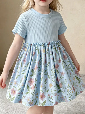Baby blue ribbed knit dress with floral print skirt and ruffled details.