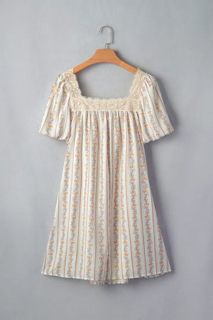 Floral mini dress with lace trim, square neck, short puff sleeves, and vertical floral stripe pattern.