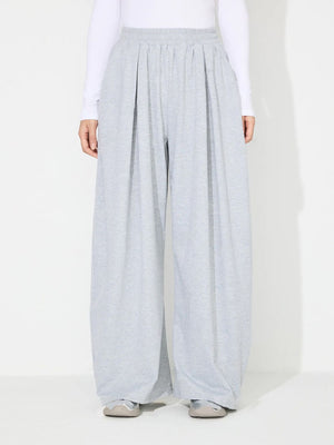 Light gray pleated drape palazzo trousers with elastic waistband.