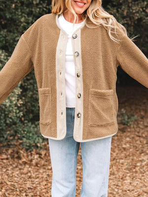 Plush corduroy patchwork jacket in camel with button front and patch pockets.