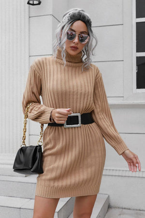 Camel ribbed turtleneck mini dress with long sleeves and a jeweled buckle belt.