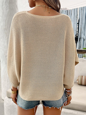 Tan open-knit dolman sleeve v-neck sweater with a relaxed fit.