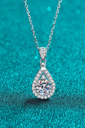 Sterling silver necklace with a halo moissanite teardrop pendant.