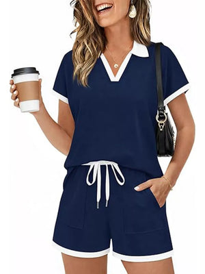 Navy blue polo collar two-piece set with white trim and drawstring shorts.