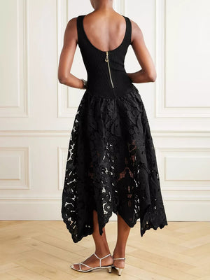 Black midi dress with crochet lace skirt and back zipper detail.