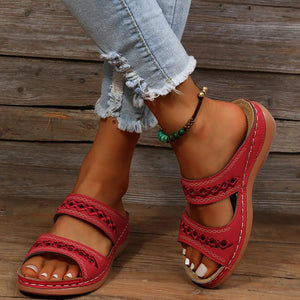 Red embroidered strap comfort slides with white stitching detail.