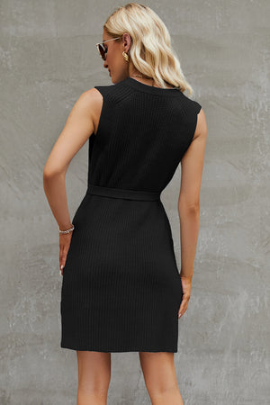 Black belted knit tank dress with a textured weave and A-line skirt.