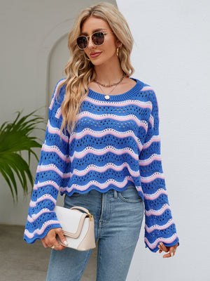 Blue and pink striped crochet crop sweater with scalloped hem and bell sleeves.