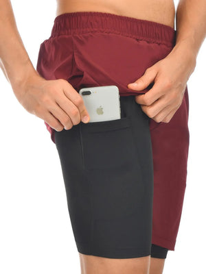 Burgundy dual-layer training shorts with black compression liner and phone pocket.