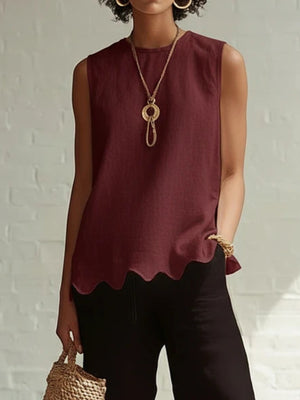 Wine red sleeveless tank top with scalloped hem detail.
