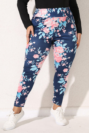 Floral bloom print leggings in peacock blue with pink and light blue flowers.