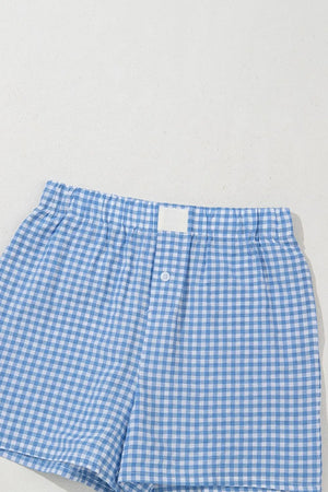 Light blue gingham boxer shorts with elastic waistband and button fly.