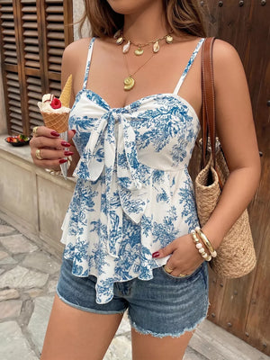 White and blue floral tie-front cami top with ruffled hem.