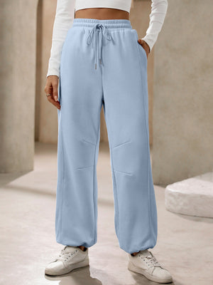 Light blue balloon-leg sweatpants with drawstring waist and pockets