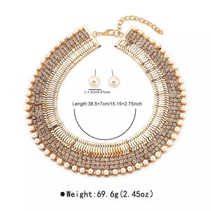 Gold-plated pearl choker necklace and matching stud earrings with crystal accents.