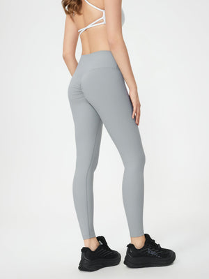 Light gray ribbed high-waist leggings with ruched butt detail.