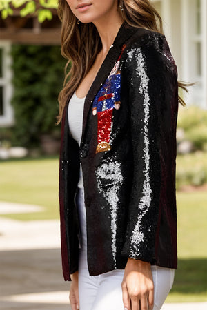 Black sequin blazer with nutcracker appliqué and single button closure.