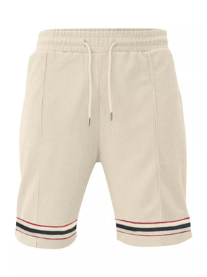 Apricot textured knit drawstring shorts with pockets and striped hem