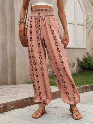 Burnt Coral gathered ankle trousers with indigo leaf print and drawstring waist.